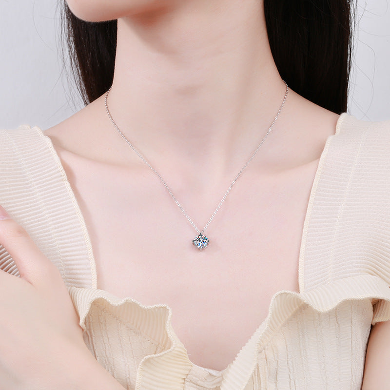 Four-prong moissanite necklace close-up