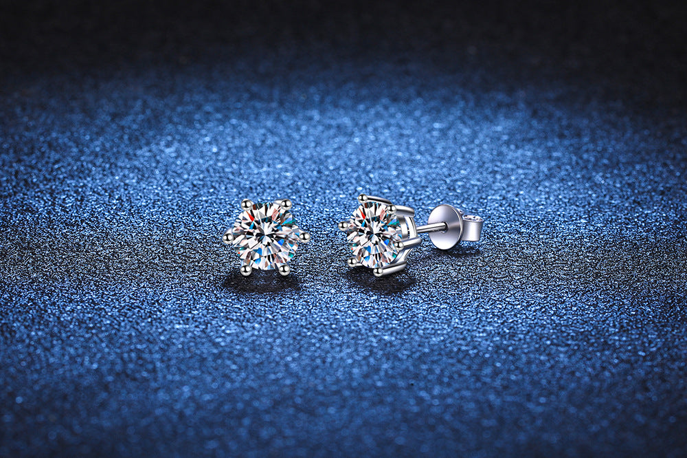 Six-prong moissanite studs worn