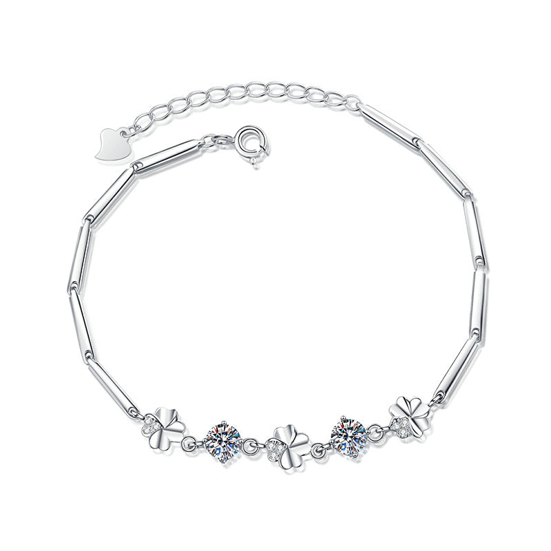 Four-leaf clover moissanite bracelet flatlay on white