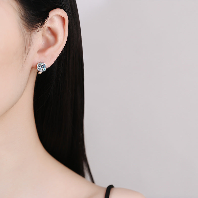 Square halo huggie earrings on ear