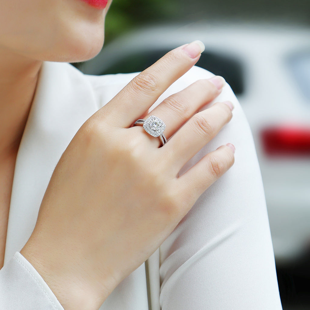 Sugar cube square halo moissanite ring worn on hand