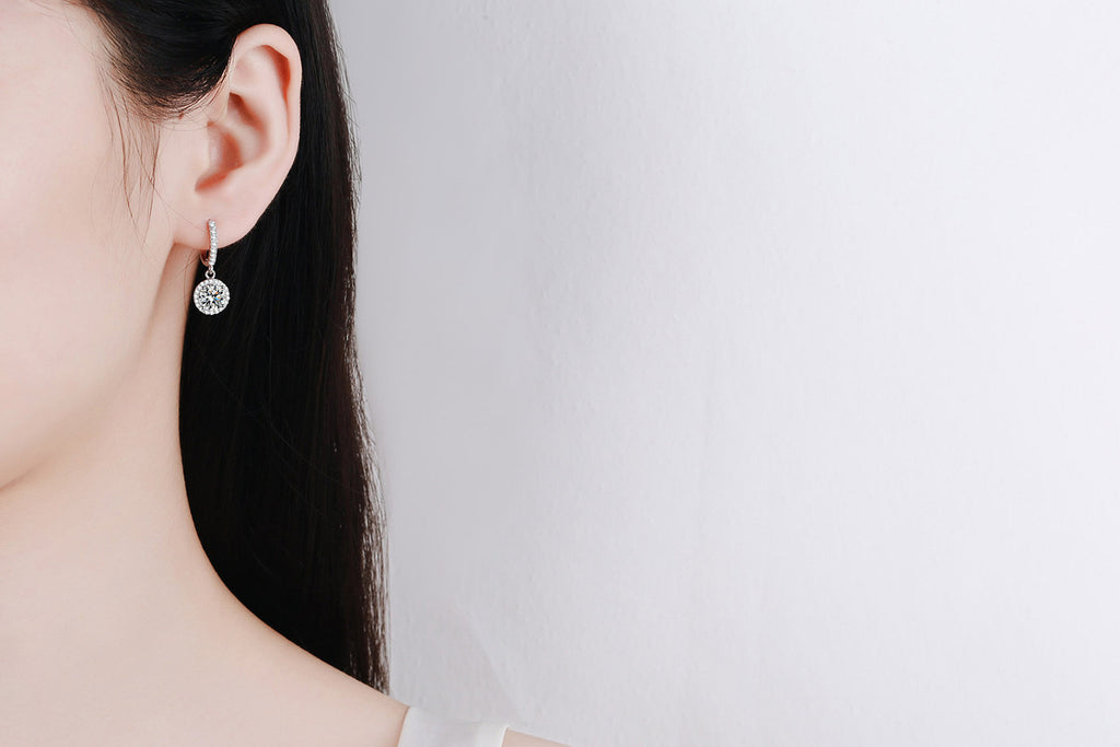 Moissanite huggie earrings on ear