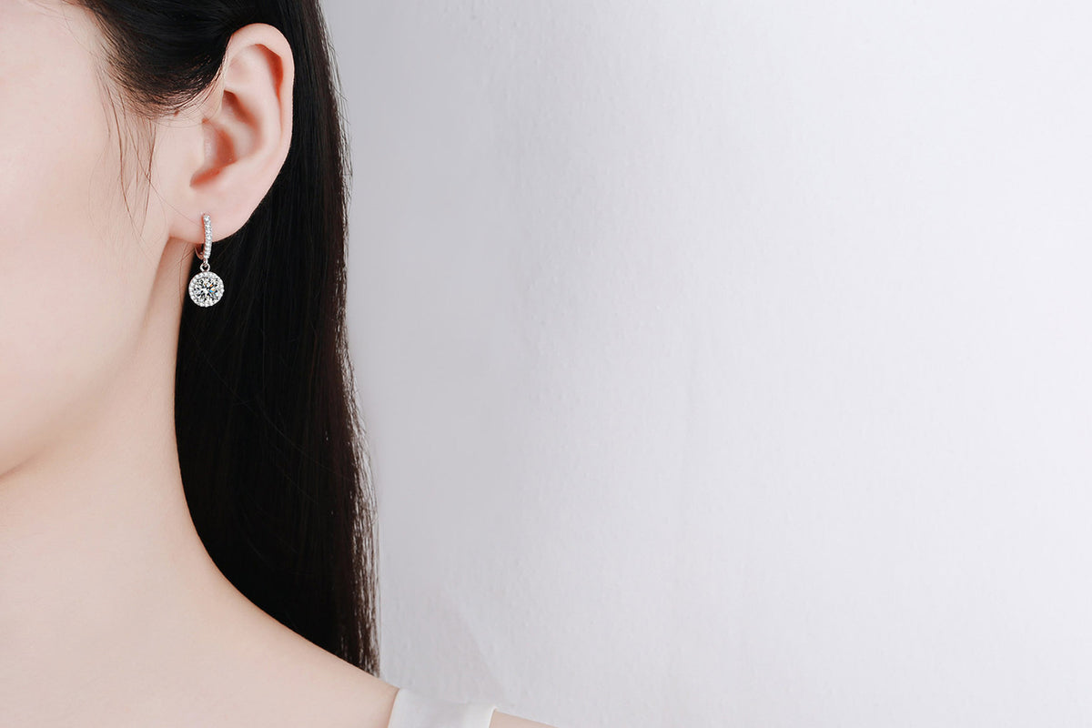 Moissanite huggie earrings on ear