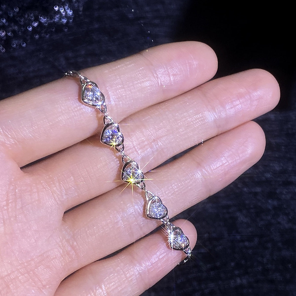 Moissanite heart bracelet sparkle in hand
