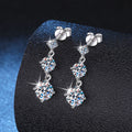 Moissanite three-stone drop earrings in sterling silver