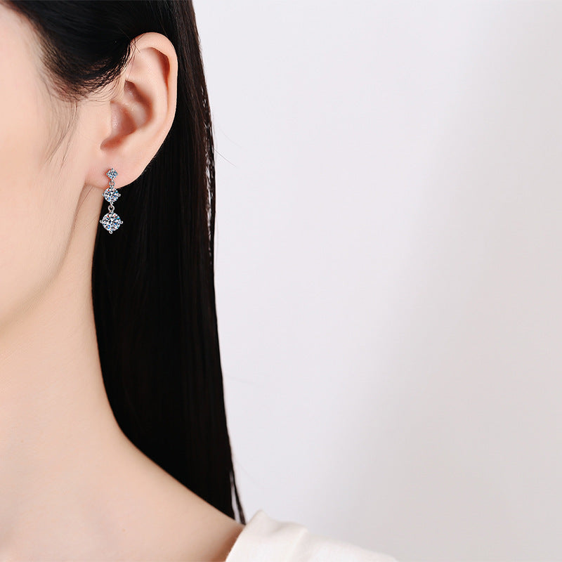 Moissanite three-stone drop earrings in sterling silver