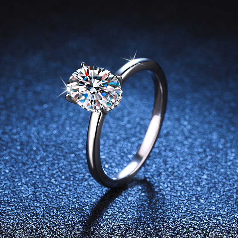 Oval moissanite solitaire ring in sterling silver, angled view