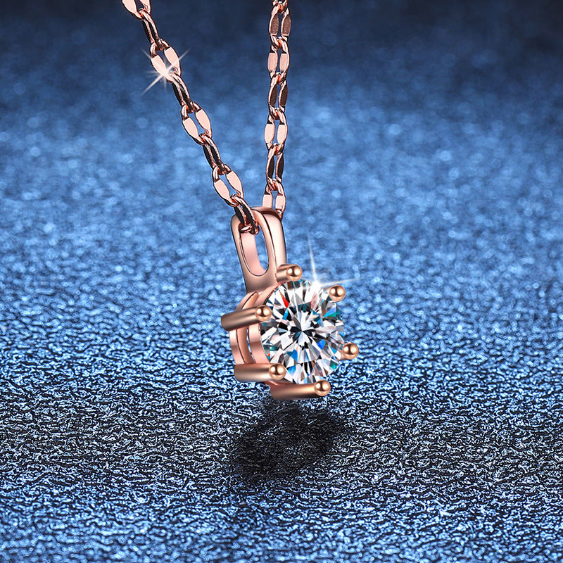 Six-prong moissanite solitaire necklace in rose gold tone