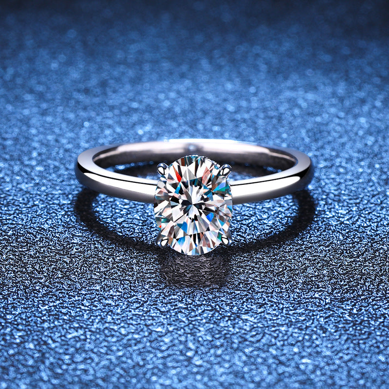 Sterling silver solitaire ring with oval moissanite center stone, detail view