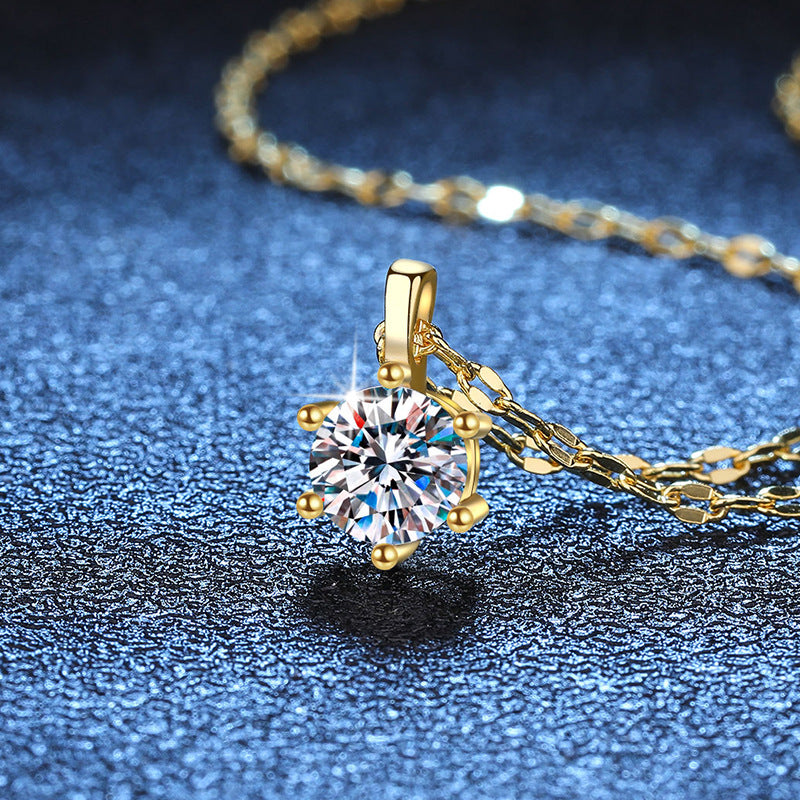 Six-prong moissanite solitaire necklace in yellow gold tone