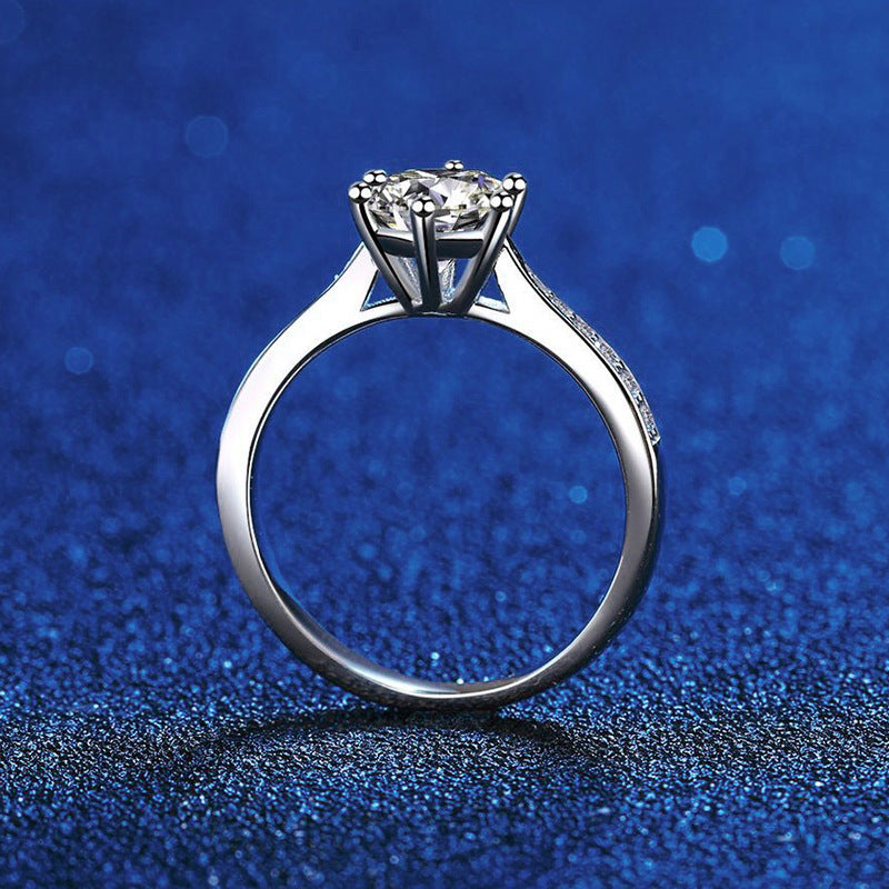 Six-prong moissanite solitaire ring with micro-pavé band in sterling silver