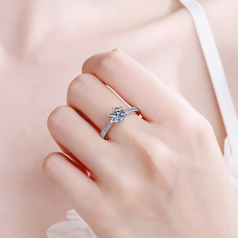 Six-prong moissanite solitaire ring with micro-pavé band in sterling silver