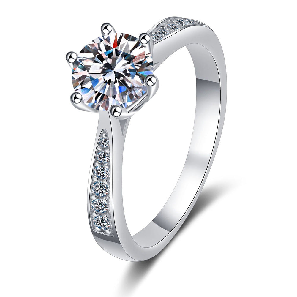 Six-prong moissanite solitaire ring with micro-pavé band in sterling silver