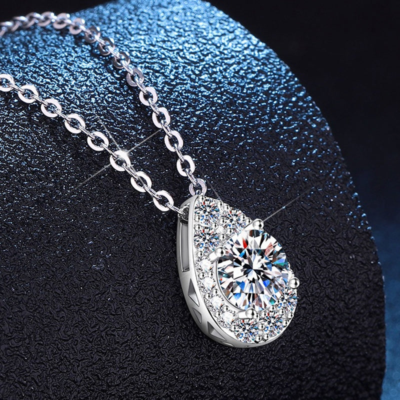 Moissanite teardrop halo pendant close-up