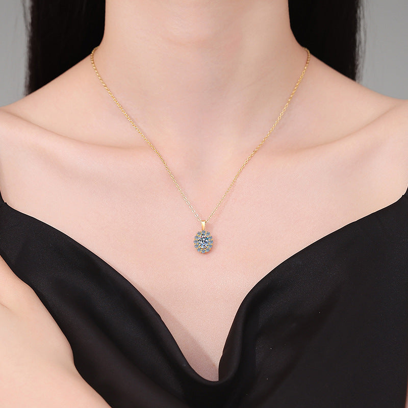 Moissanite oval halo pendant necklace worn on model