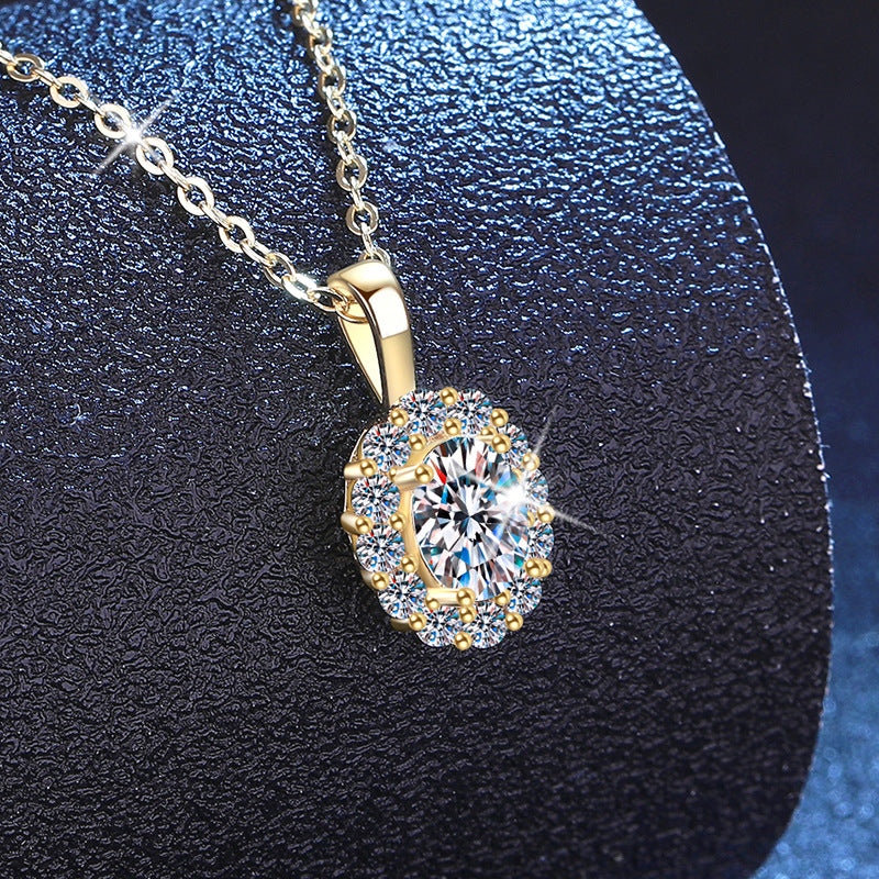 Moissanite oval halo pendant necklace on display